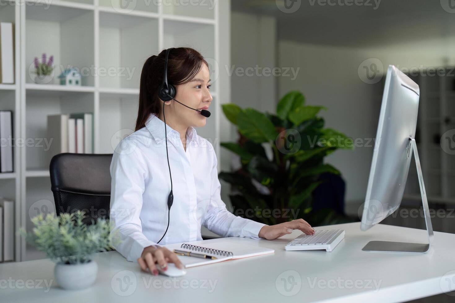 Call center friendly woman asian in office for customer service, technical support and advice, contact and communication with employee operator in help desk agency photo