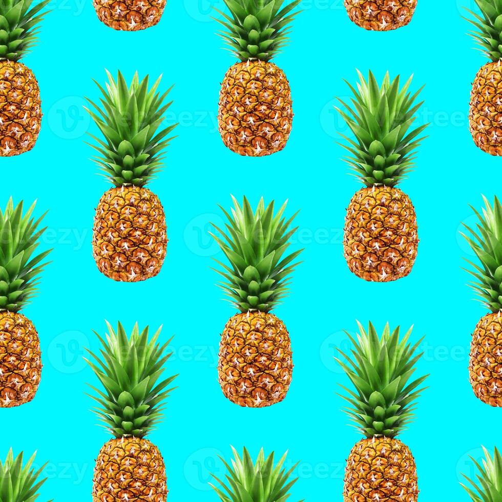 Pineapple seamless pattern on blue background photo