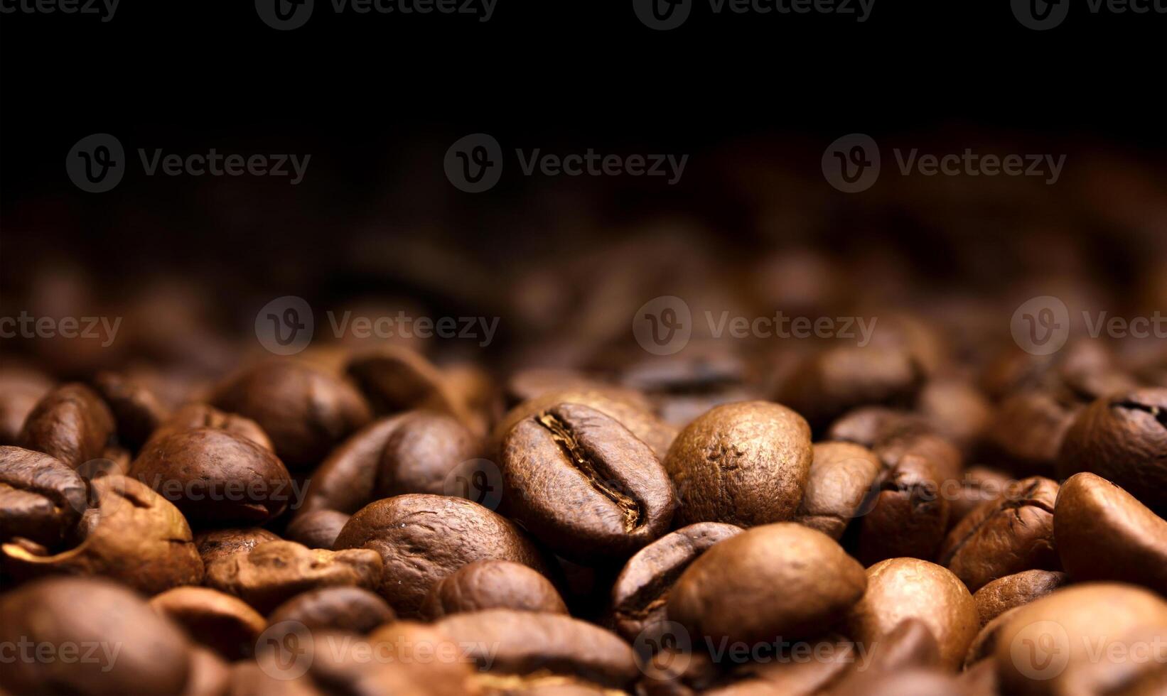 Coffee beans on black background, copy space photo