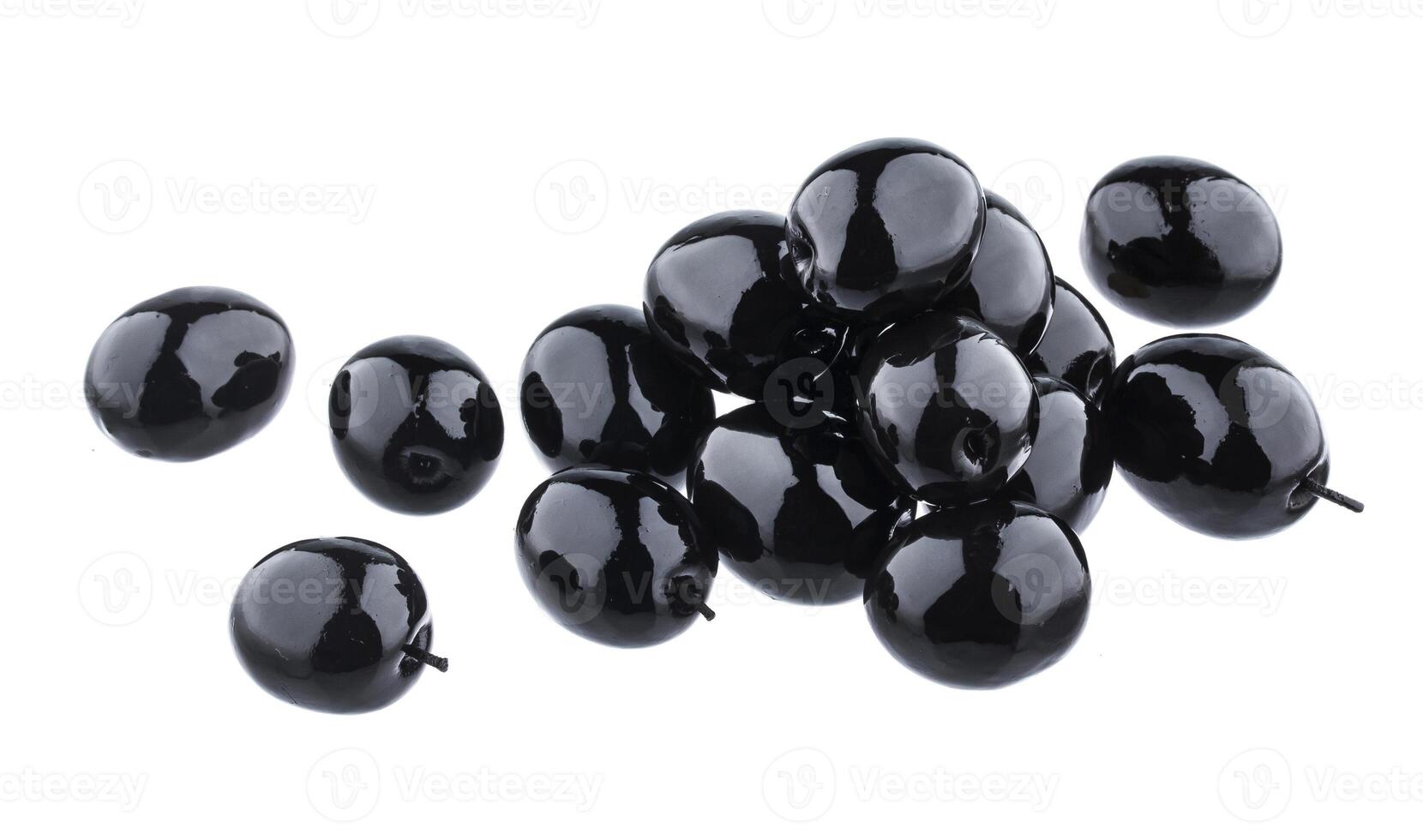Heap of black olives isolated on white background with clipping path photo