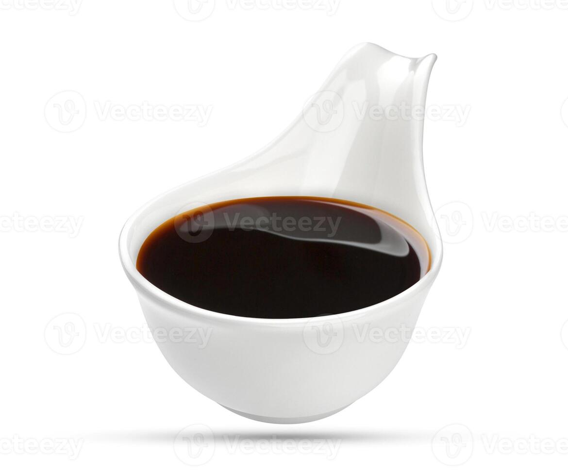 Soy sauce in bowl isolated on white photo