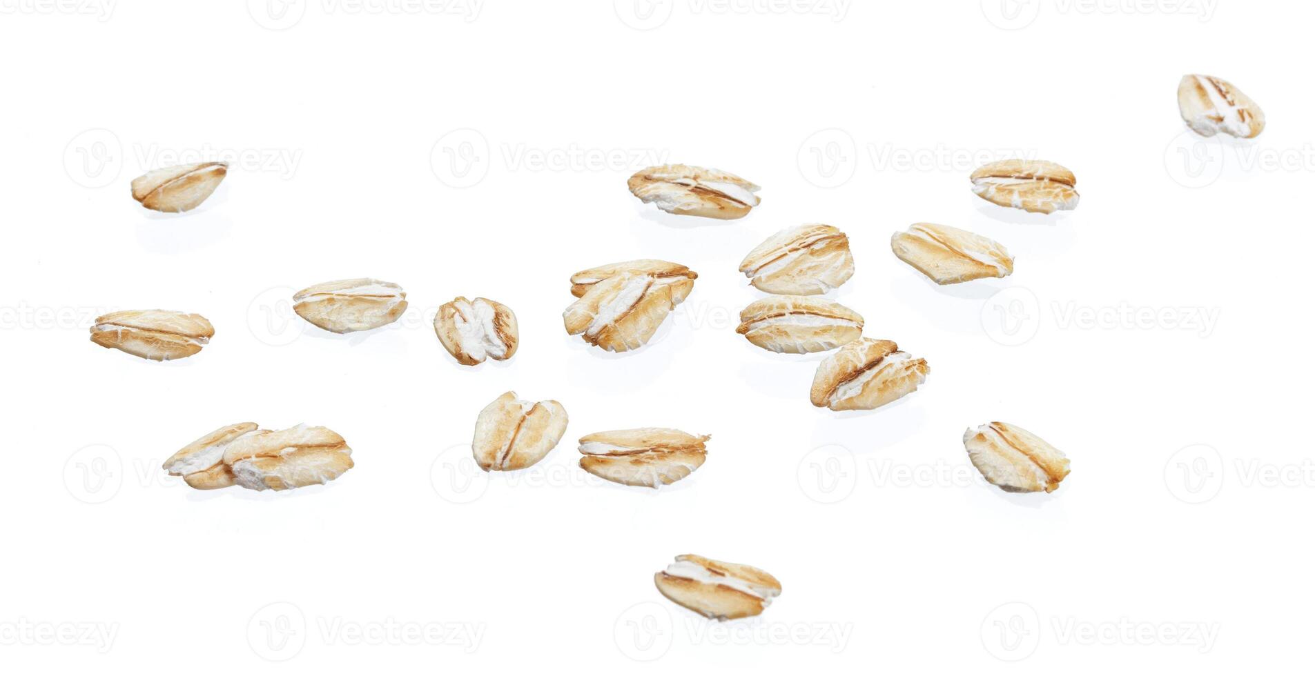 Oat flakes isolated on white background. Close up. photo