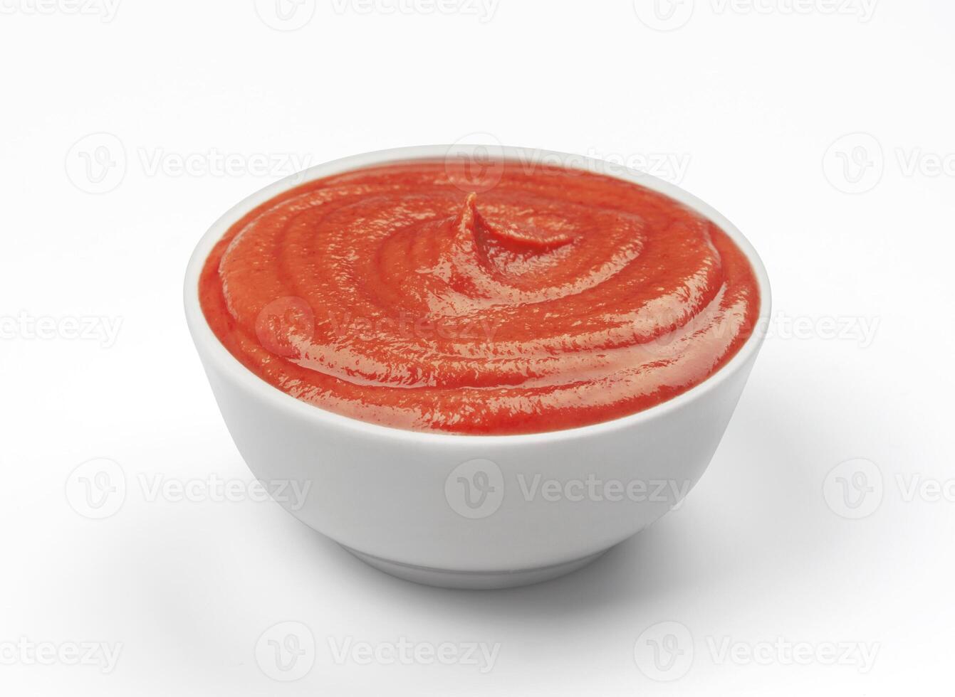 Ketchup in white bowl isolated. Tomato sauce. photo