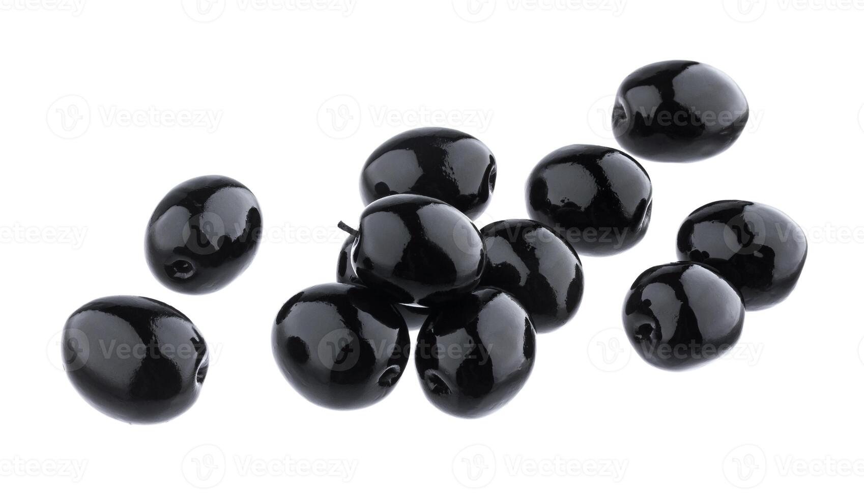 Heap of black olives isolated on white background with clipping path photo