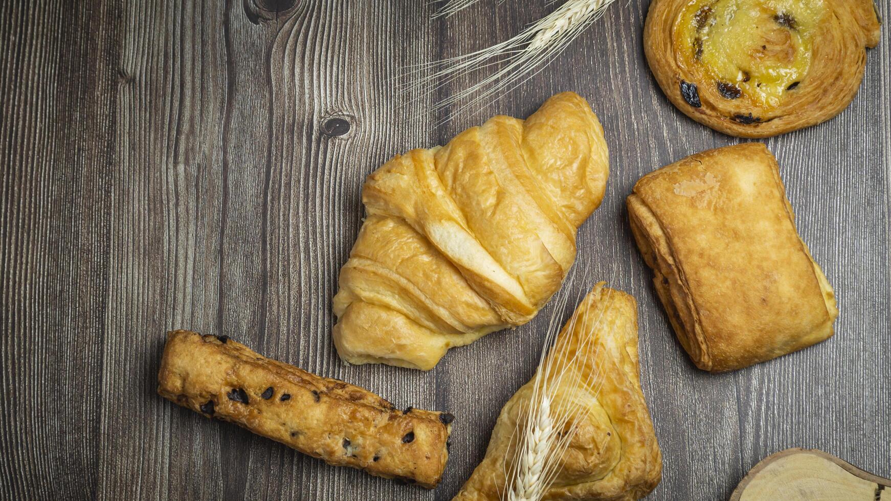 a variety of pastries on a wooden table photo