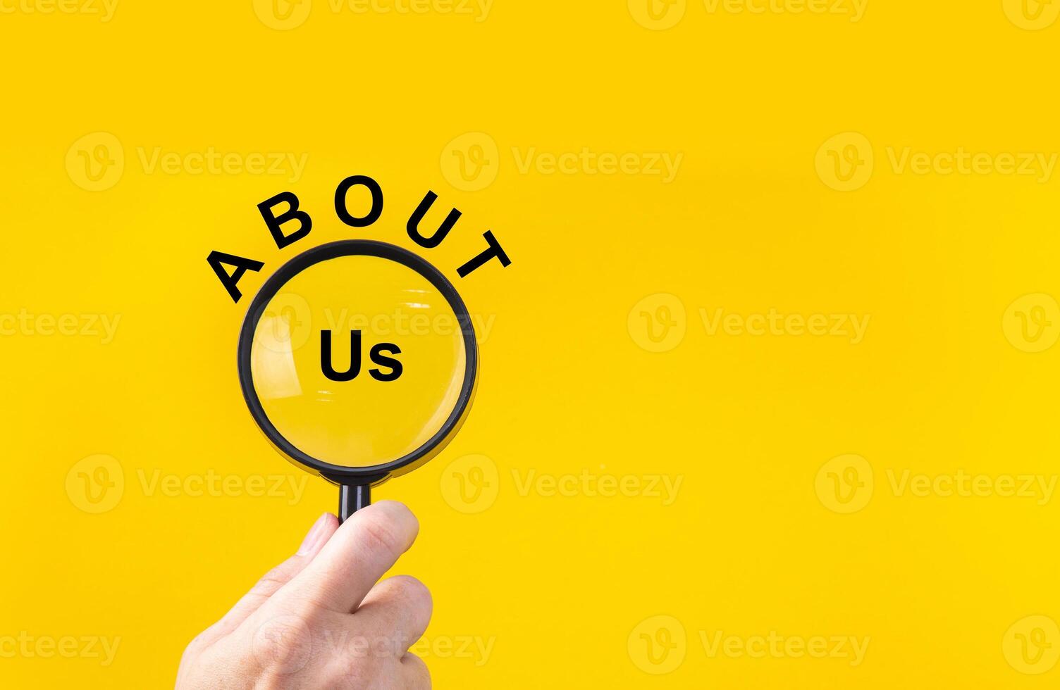 Phrase about us with magnifying glass. photo