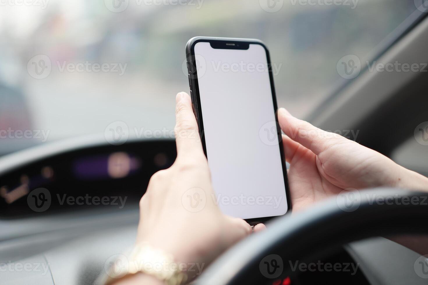 Phone in car, hand using smartphone on car photo