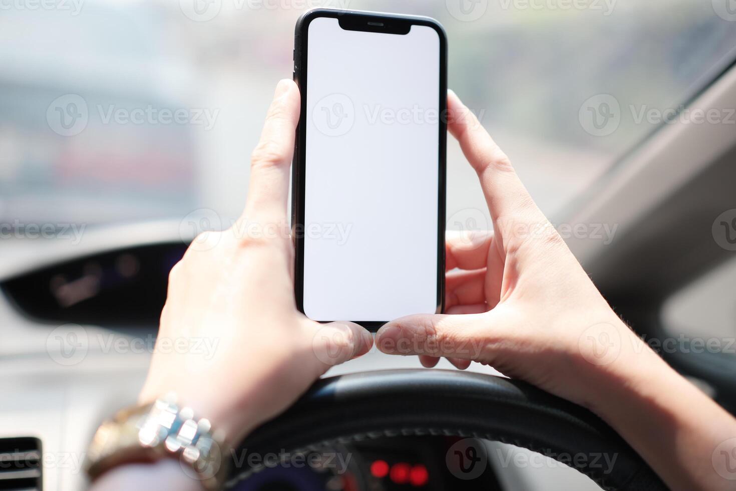 Phone in car, hand using smartphone on car photo