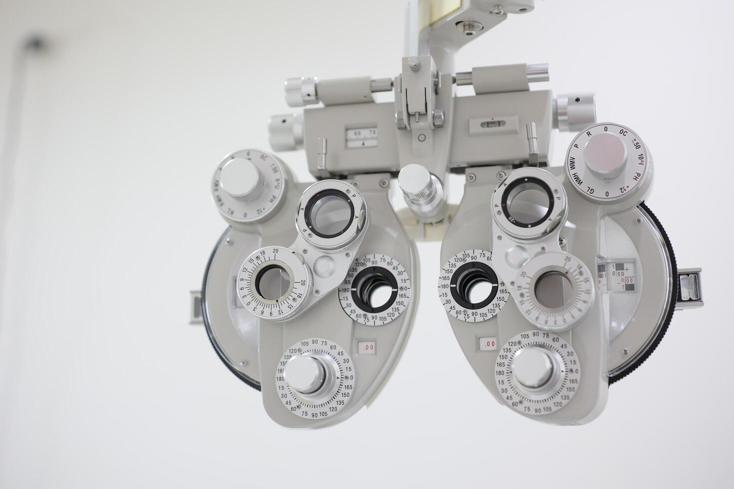 Phoropter for eye test, lenses glasses for eye check in optical store photo