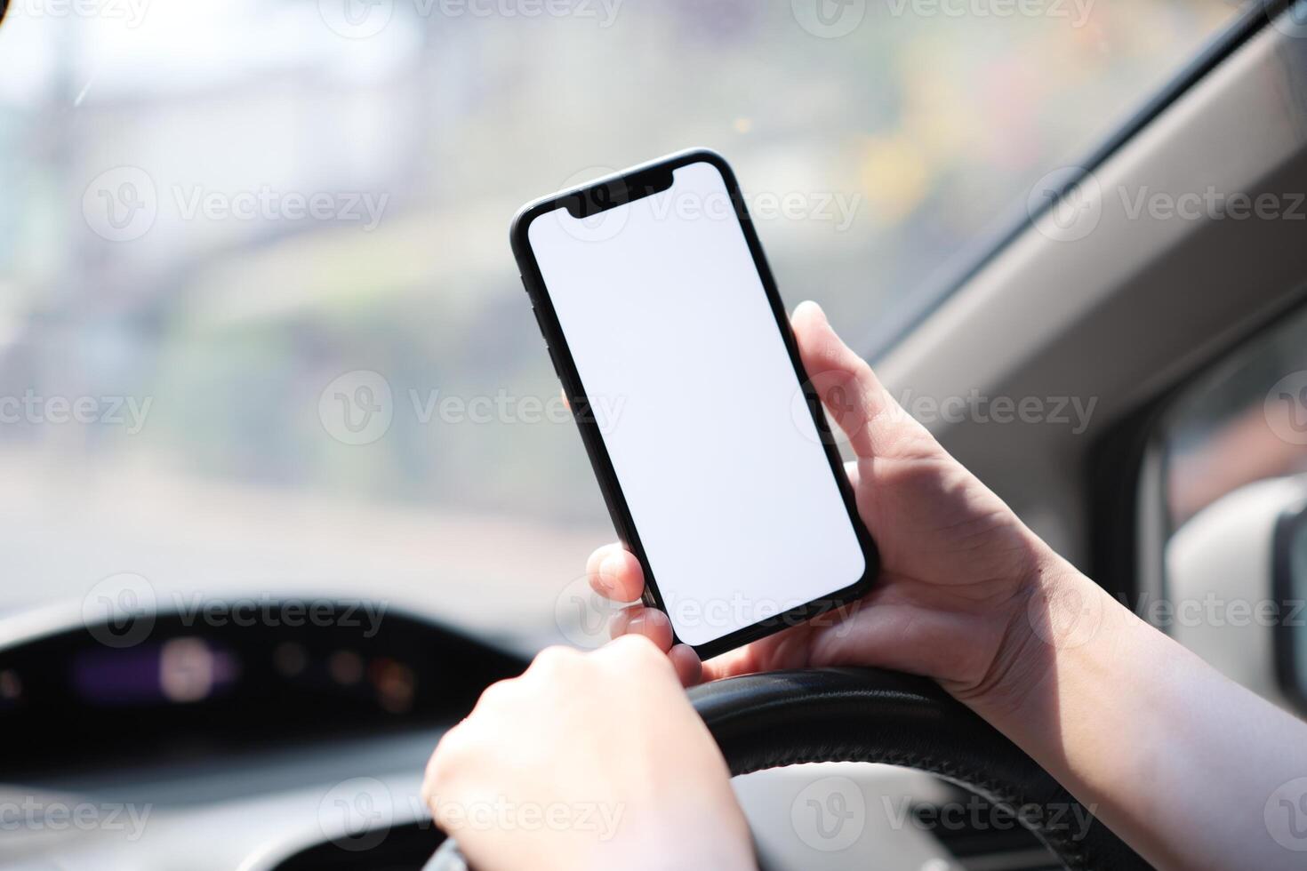 Phone in car, hand using smartphone on car photo