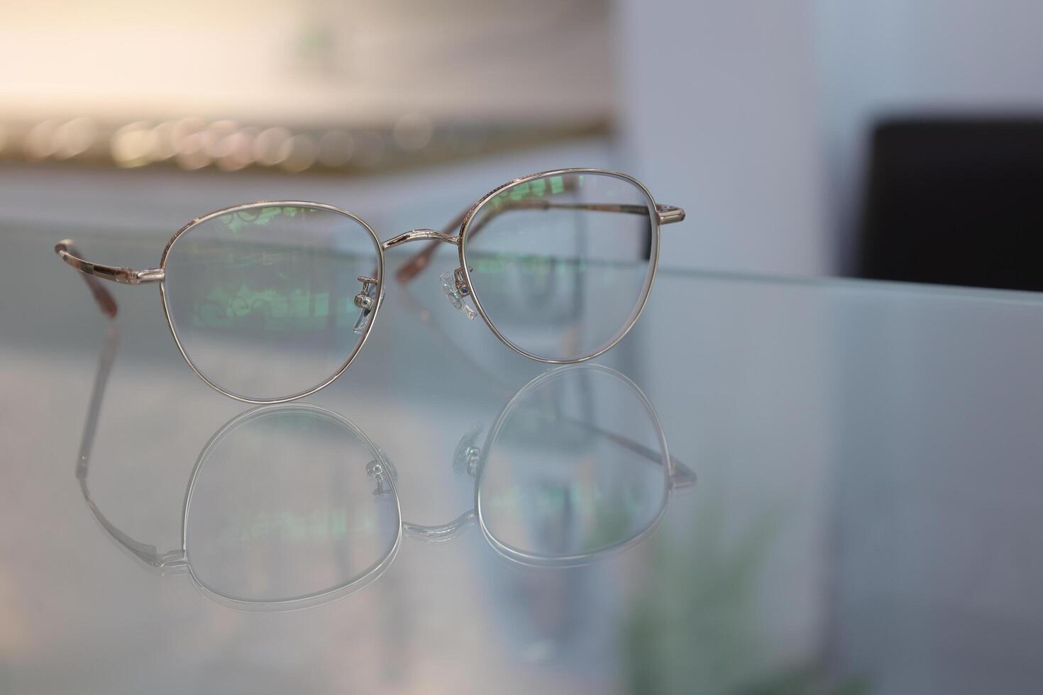 Eyeglasses on table, progressive lenses, eyeglasses for the elderly, glasses progressive lens, eyeglass progressive lens, close-up of glasses on lenses test, looking through glasses photo
