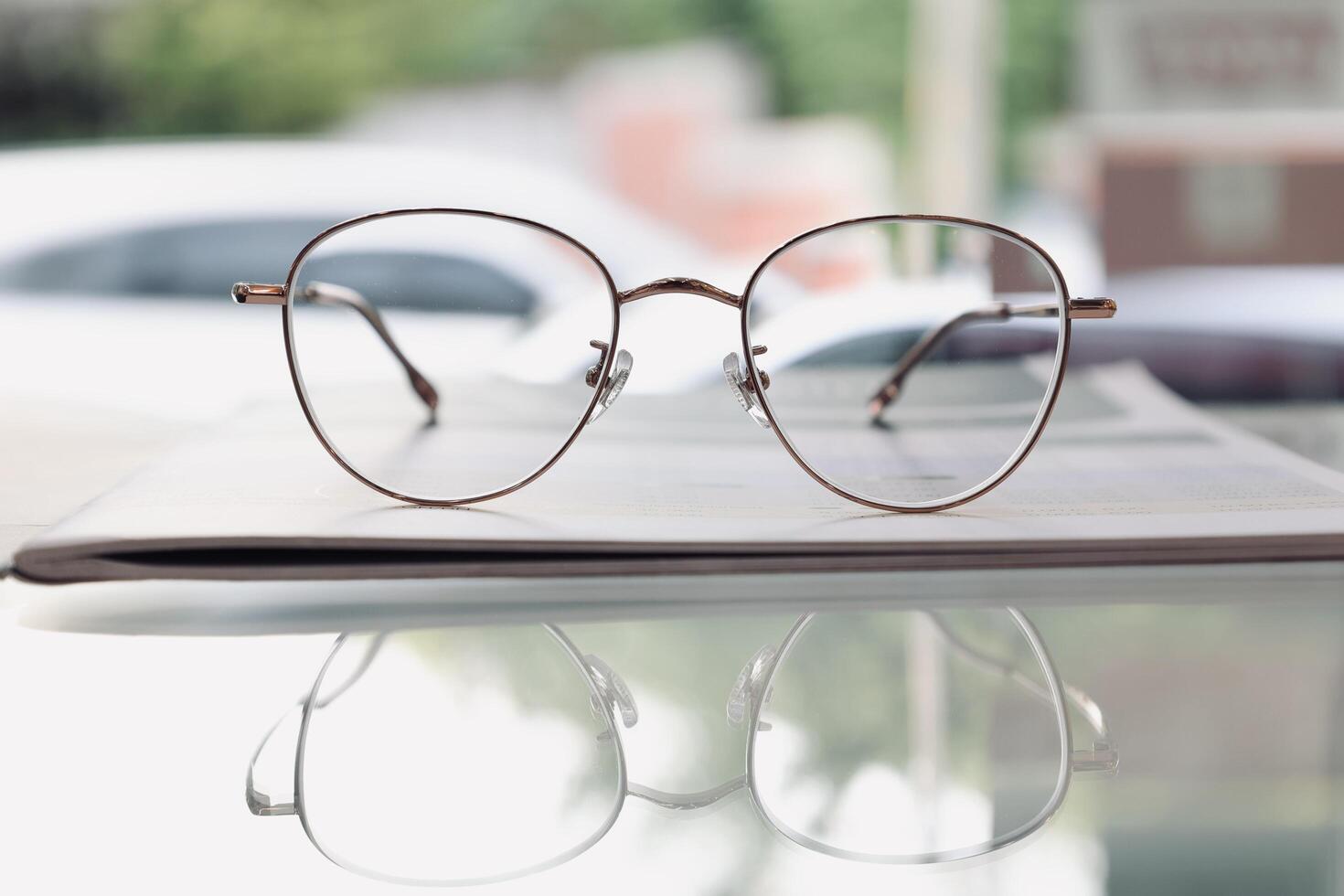 Eyeglasses on table, progressive lenses, eyeglasses for the elderly, glasses progressive lens, eyeglass progressive lens, close-up of glasses on lenses test, looking through glasses photo