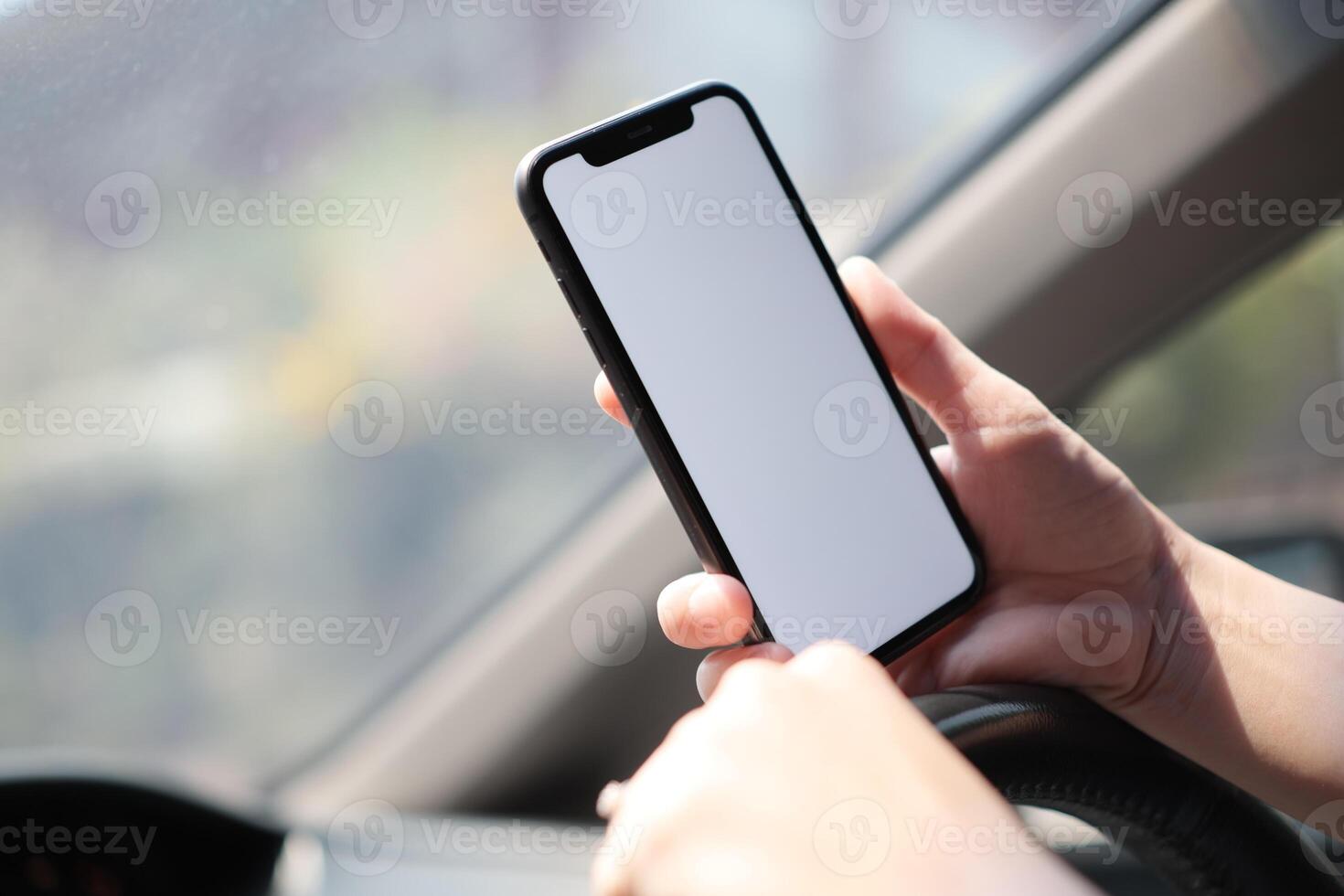 Phone in car, hand using smartphone on car photo