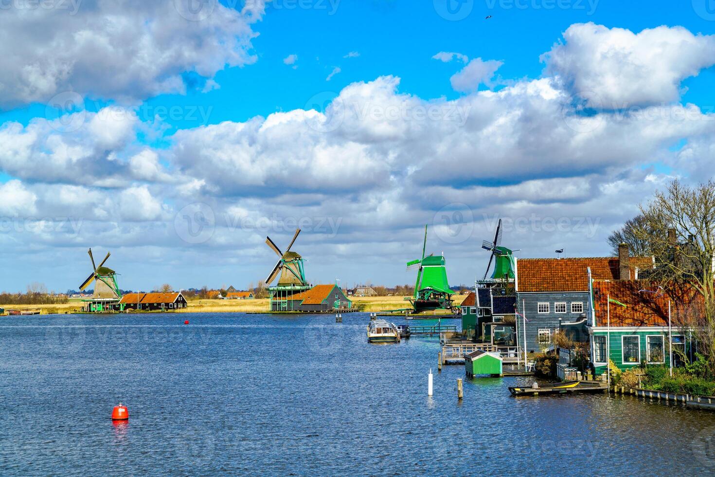 View of windmills at Zaanse Schans in Netherlands photo