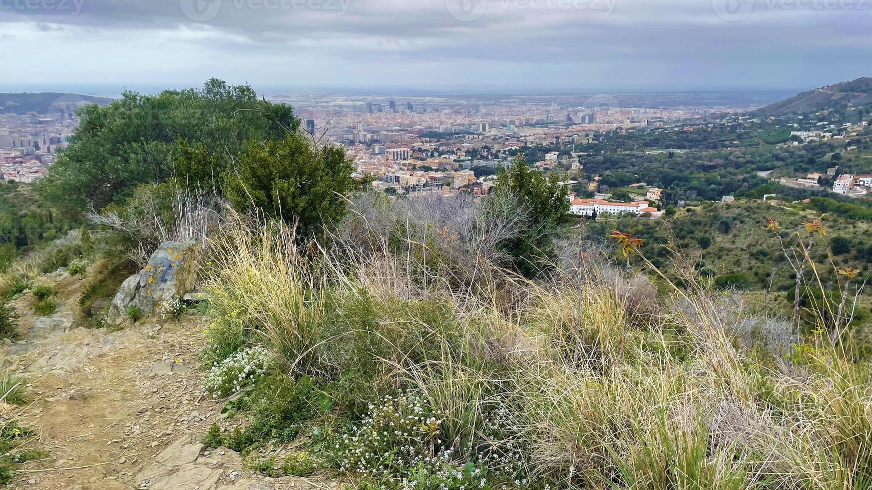 Panoramic view of Barcelona city from the hill, Montjuic side, rainy weather landscape photo