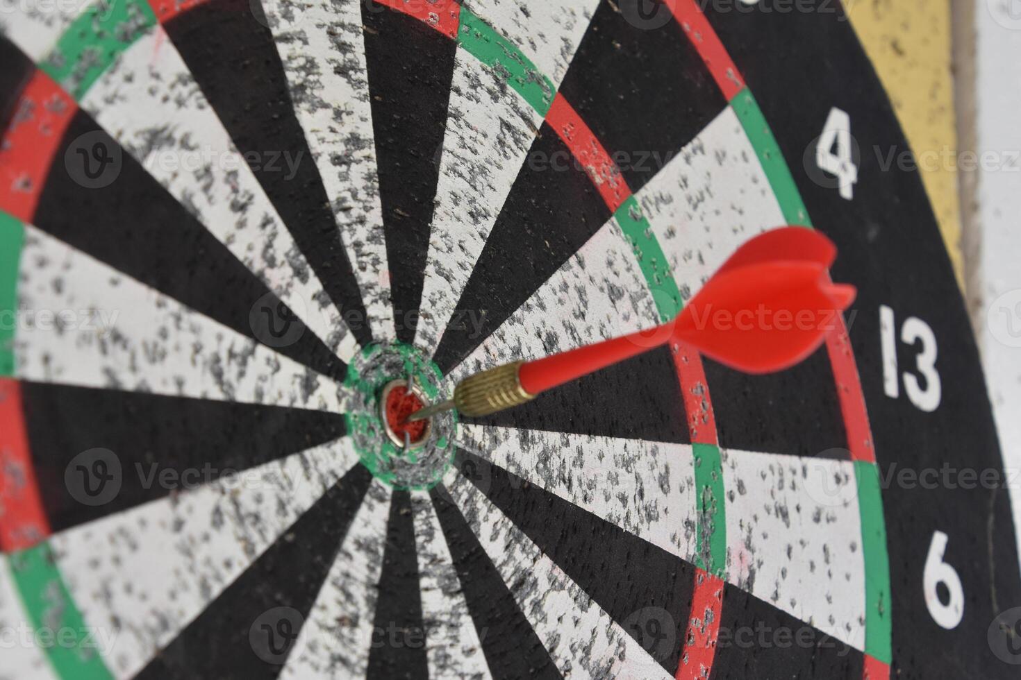 Red Dart in the Center of a Dart Board photo