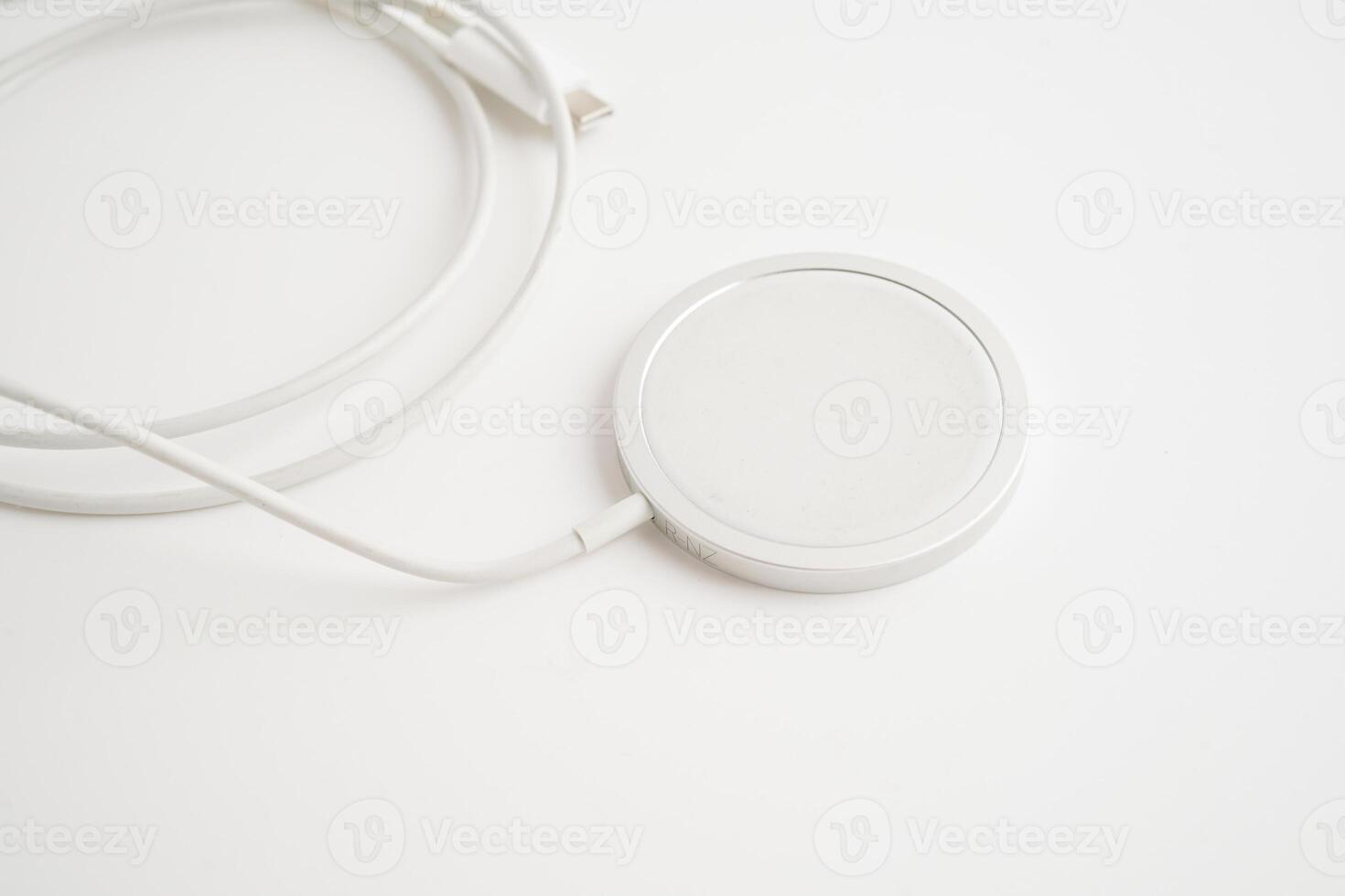 Wireless charger, magnetic charging modern equipment of mobile phone. photo