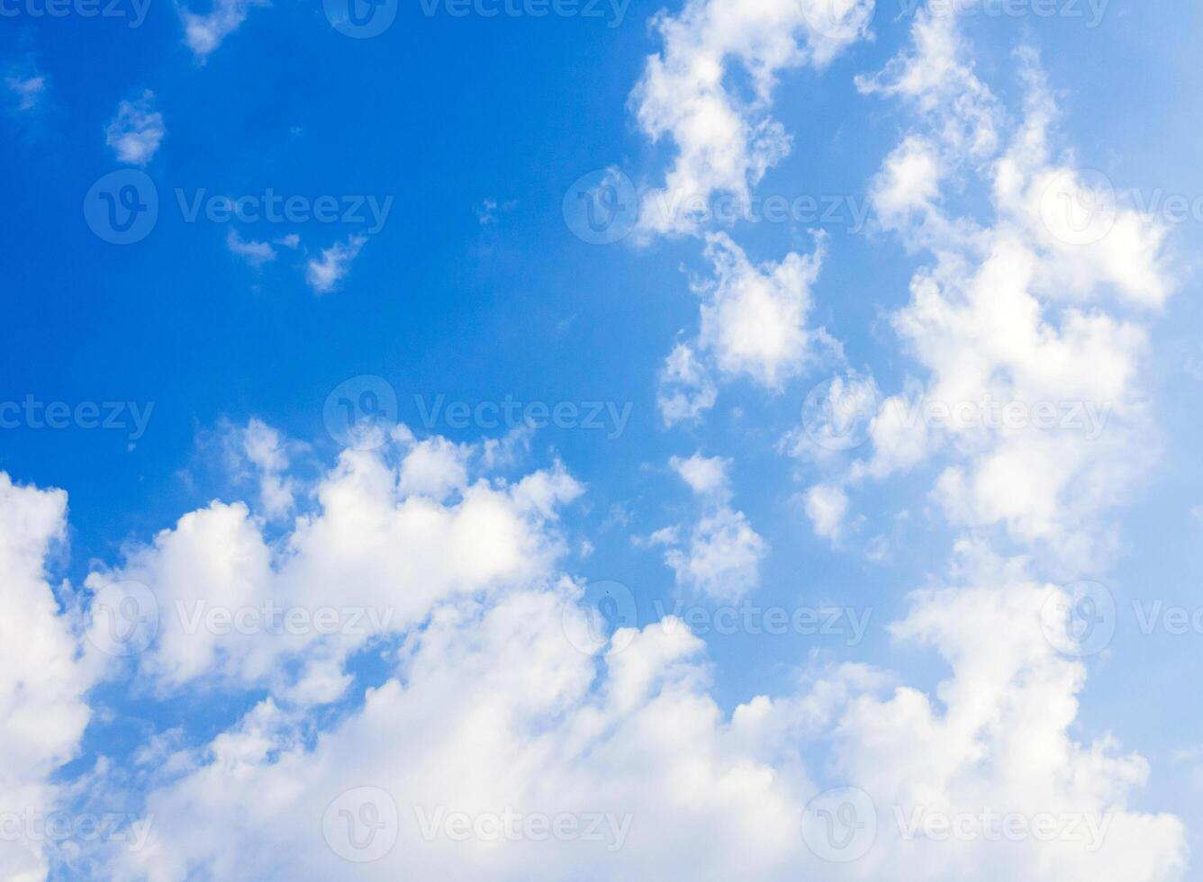 blue sky background with tiny white clouds photo