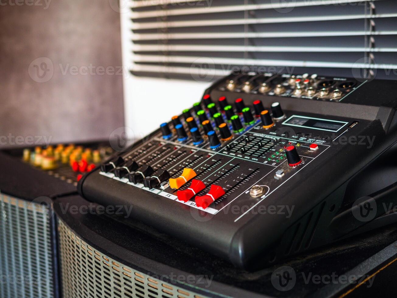 Close-up of sound recording equipment knobs.Mixer control. Music engineer. Backstage controls on an audio mixer, Sound mixer. Professional audio mixing console, buttons, faders and sliders. photo