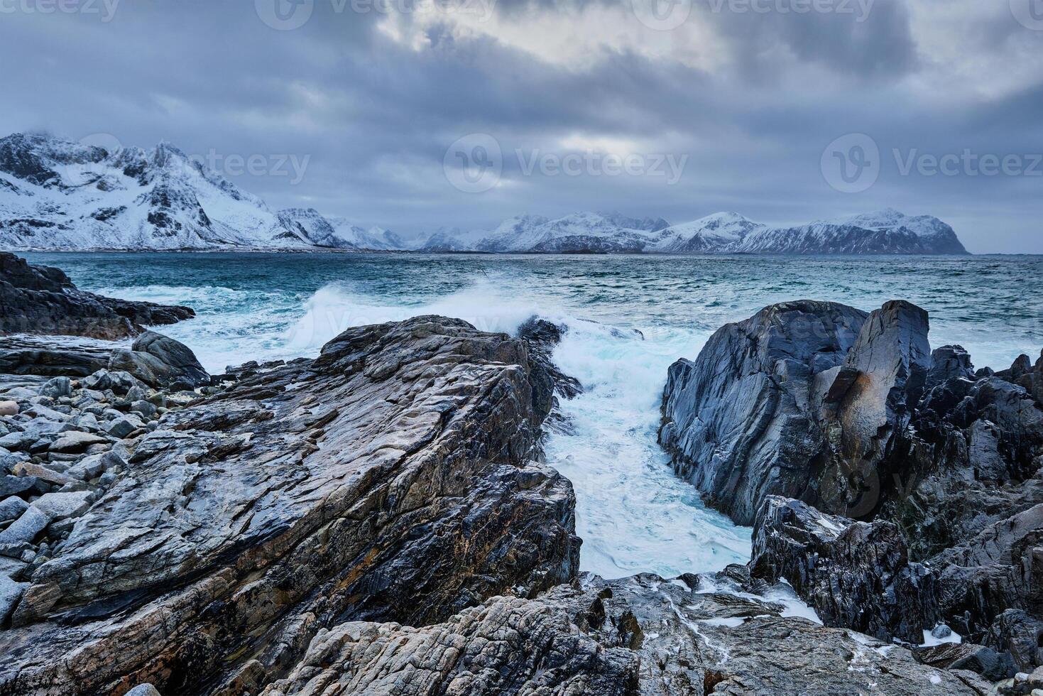 Norwegian Sea waves on rocky coast of Lofoten islands, Norway photo