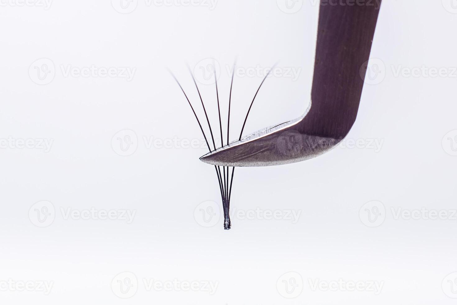 Eyelash Extension tools on white background. Accessories for eyelash extensions. Artificial lashes. 4D, closeup , selective focus. photo