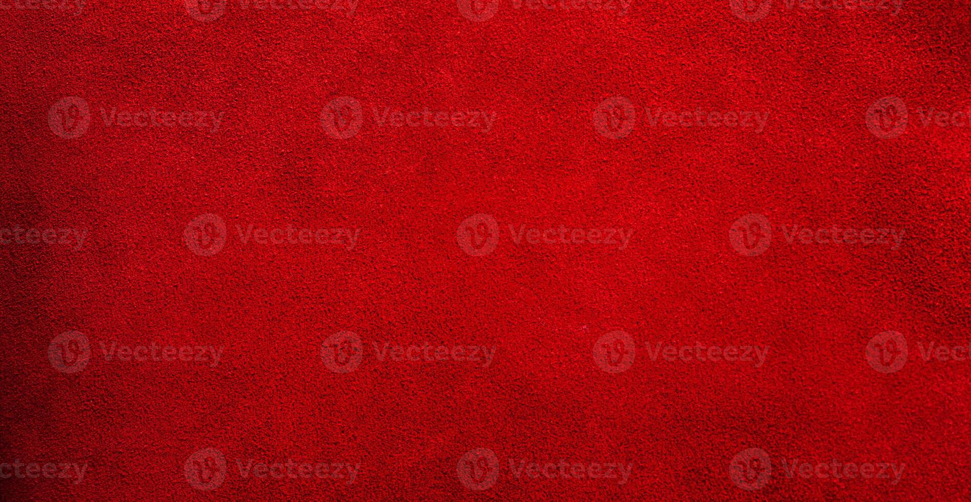 Suede genuine leather is red as a background. Red velvet material web size. photo