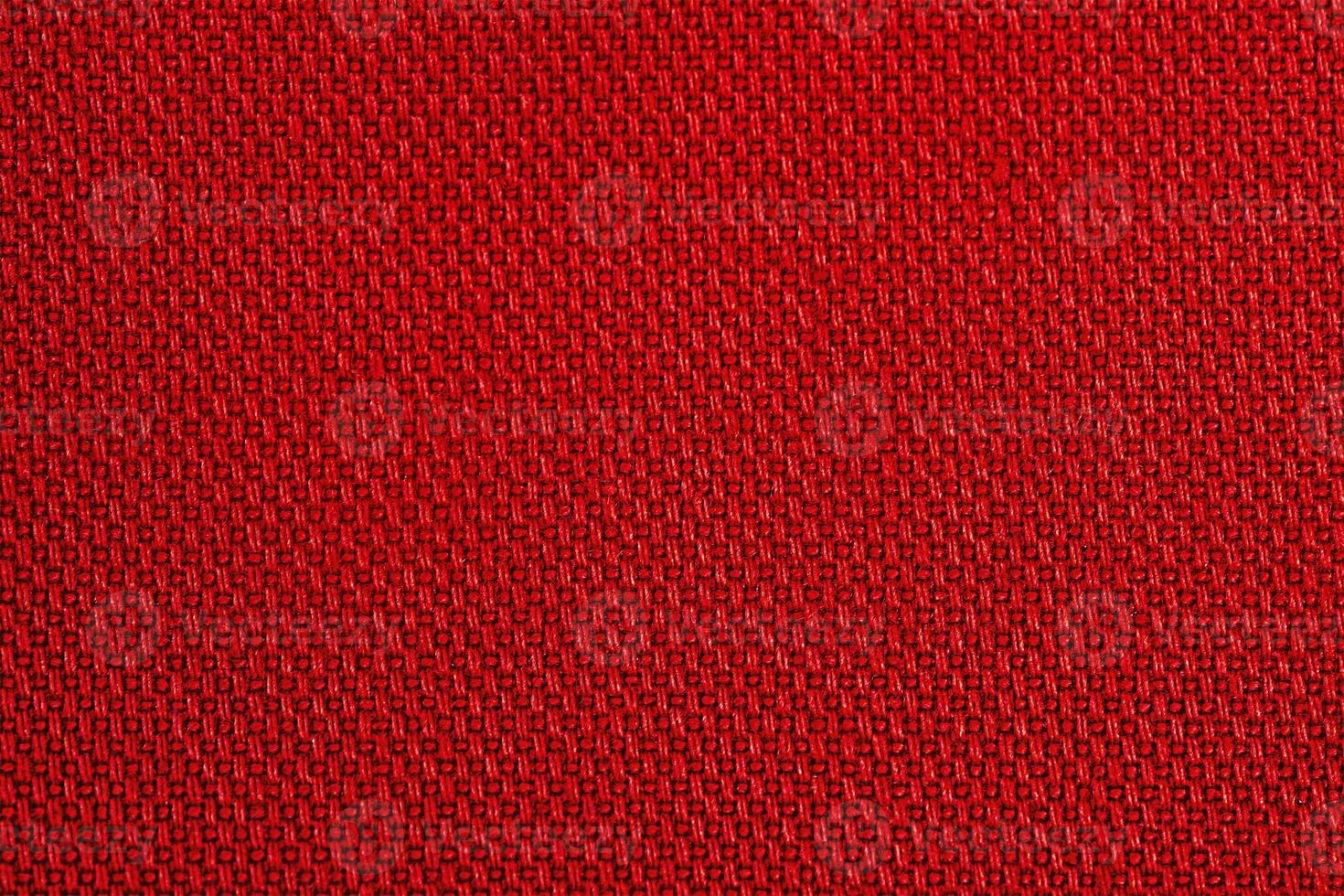 Red fabric as background macro photo. Fabric texture. photo