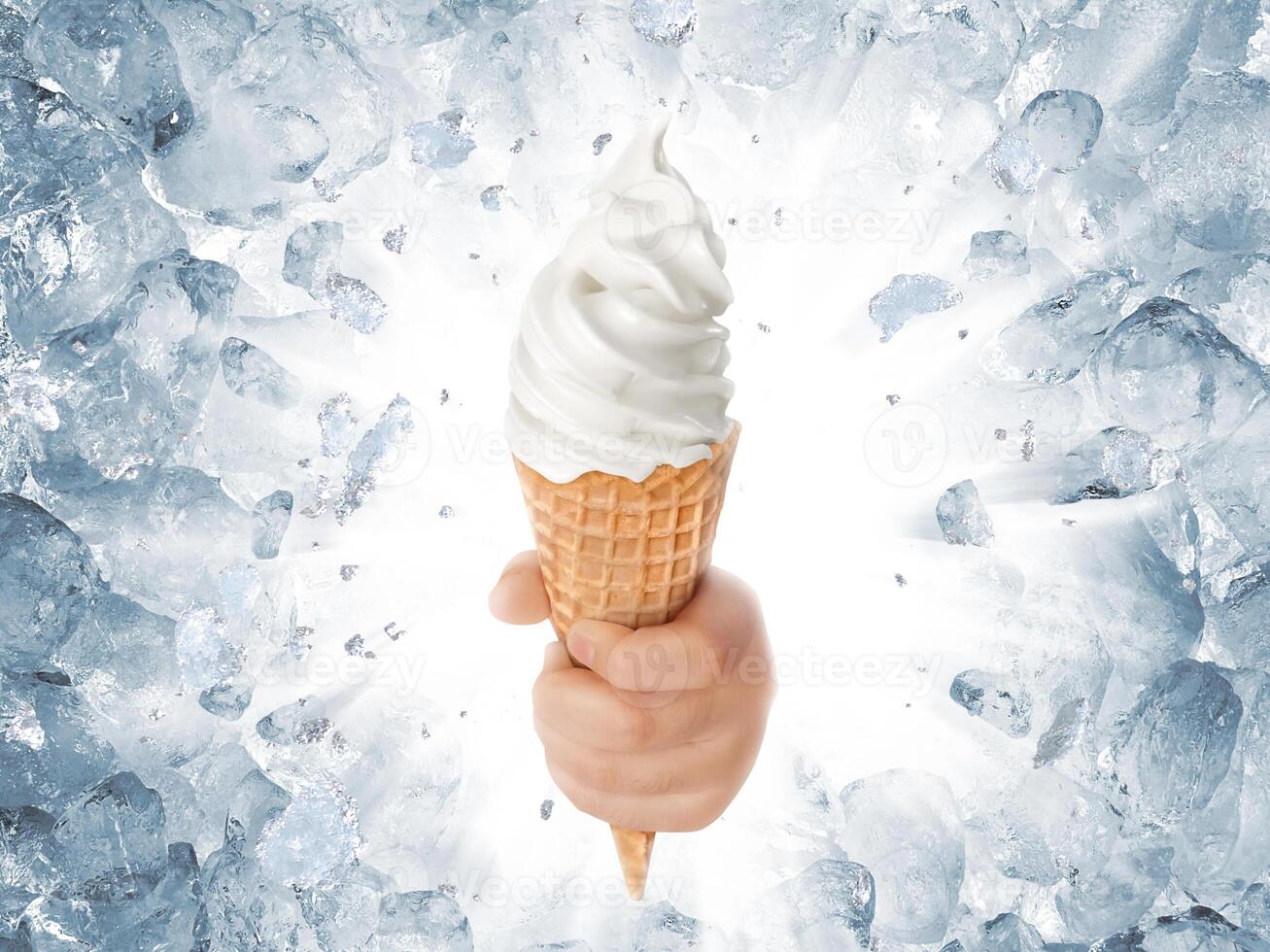 Soft ice cream in hand on background of broken ice photo