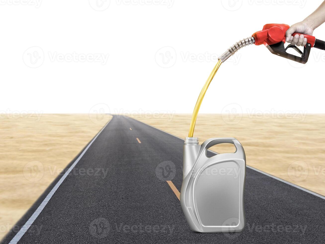 Hold the gasoline injector into the gallon. There are road and desert backgrounds. photo