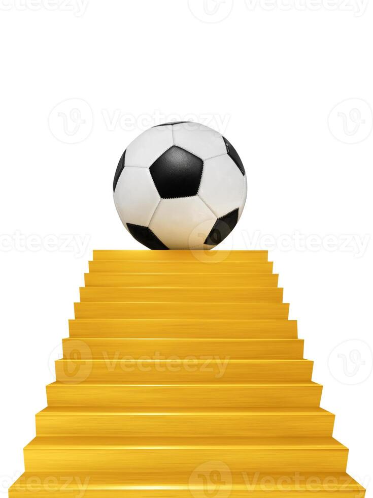 A soccer ball is displayed on a golden staircase. photo