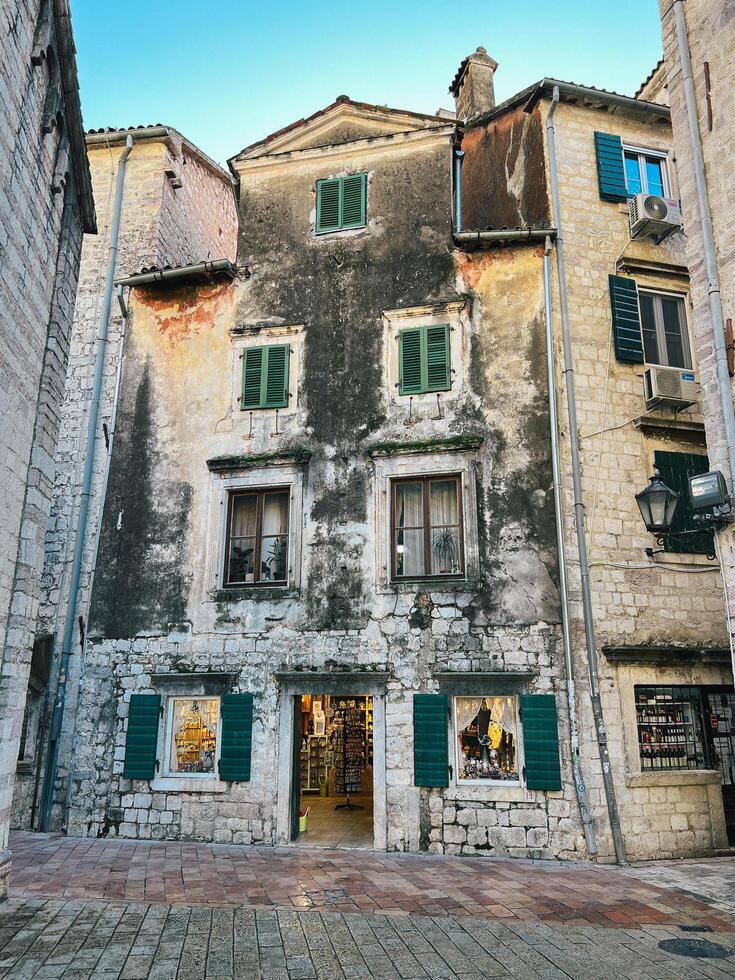 Kotor, Montenegro - 25 december 2022. Old shabby stone building facade photo