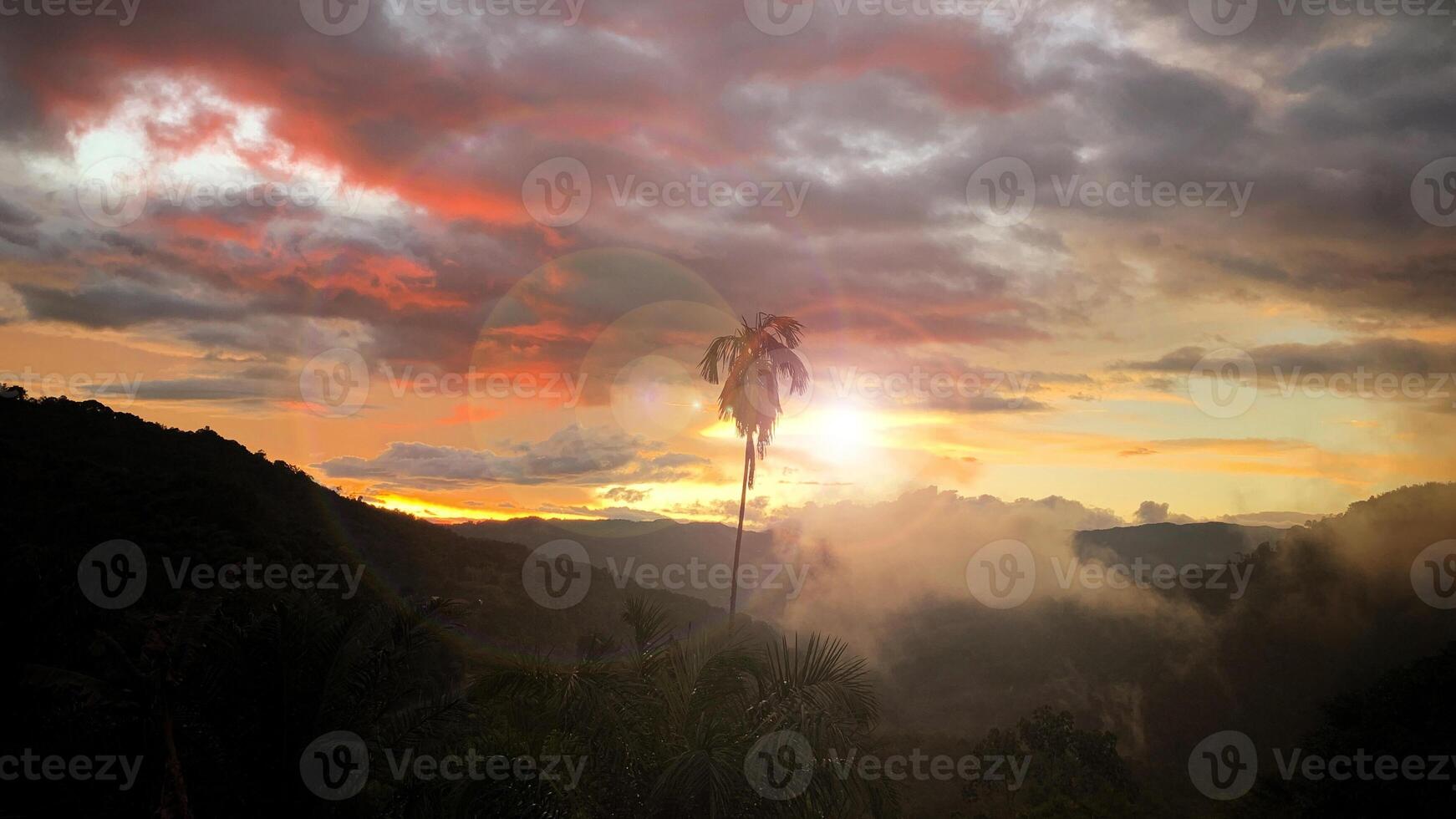 Evening view of sunset with mountain and hill background. Nature beauty concept photo