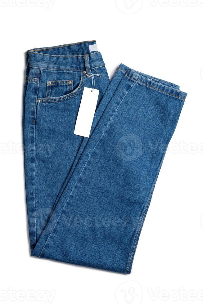 Blue jeans pants and price tag isolated on white background, mockup, copy space photo