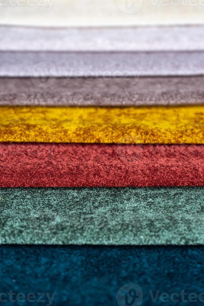 Multi colored set of upholstery fabric samples for selection, collection of textile swatches photo