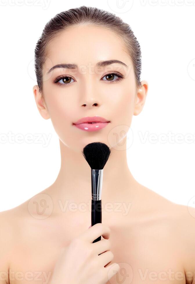 Female with cosmetic brush photo