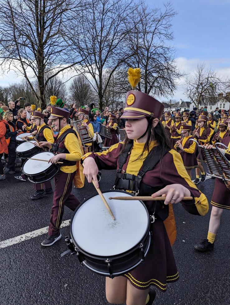 Galway, Ireland  03.17.2024 Saint Patrick's Day parade passing trough Galway city in Ireland photo