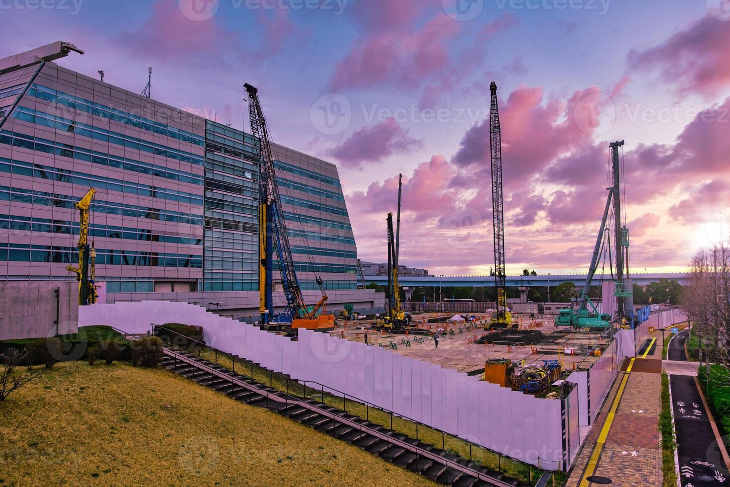 A dusk of crane at the under construction near the railway wide shot photo