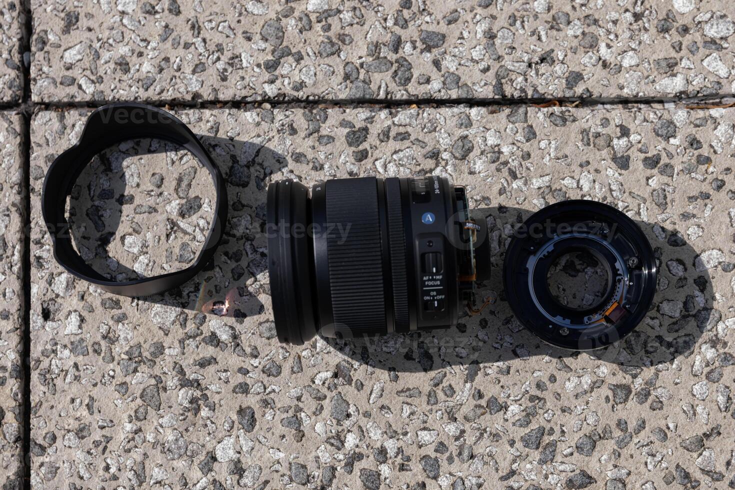 A broken lens on the street sunny day handheld photo
