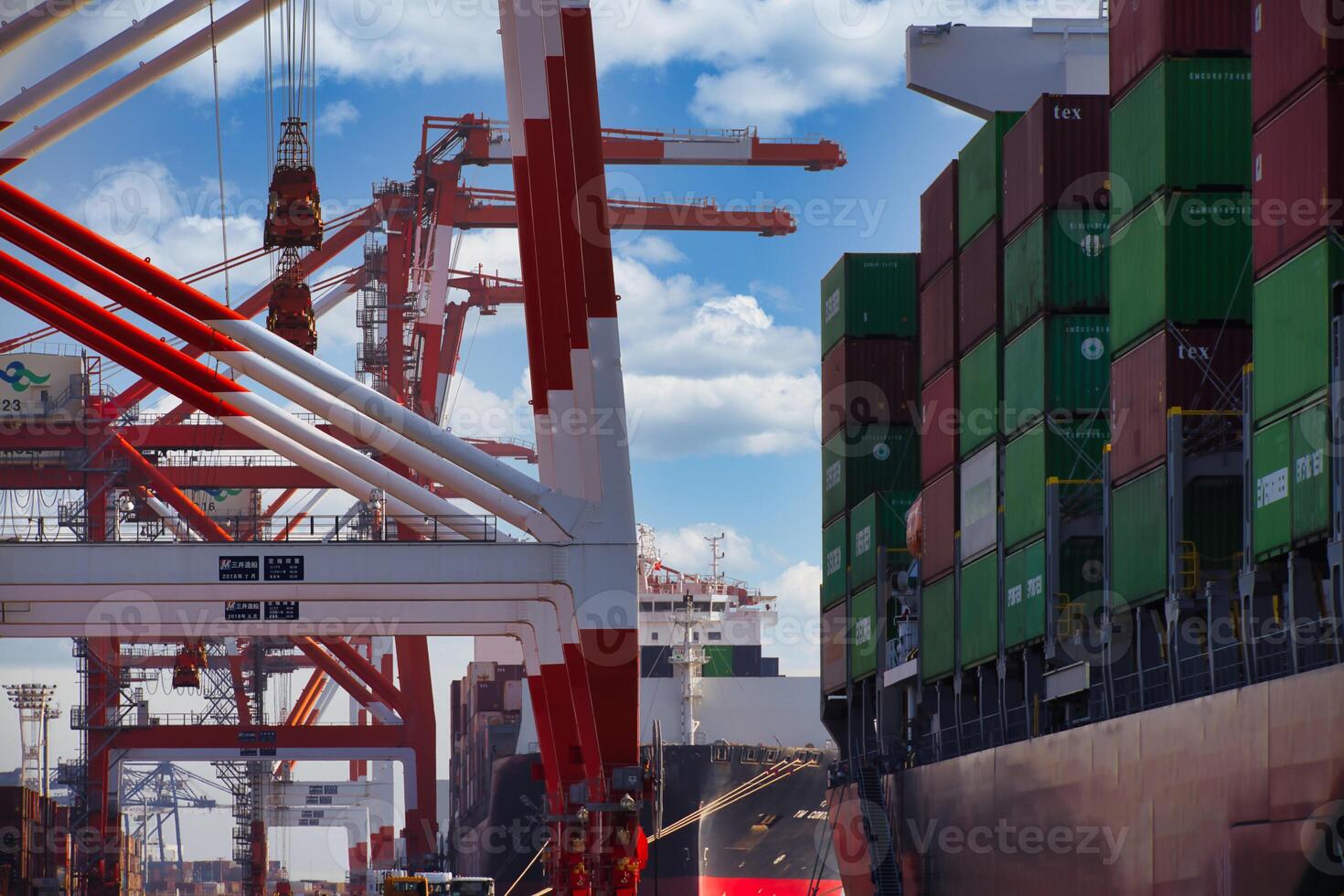 Containers and cranes near the port in Aomi Tokyo telephoto shot photo
