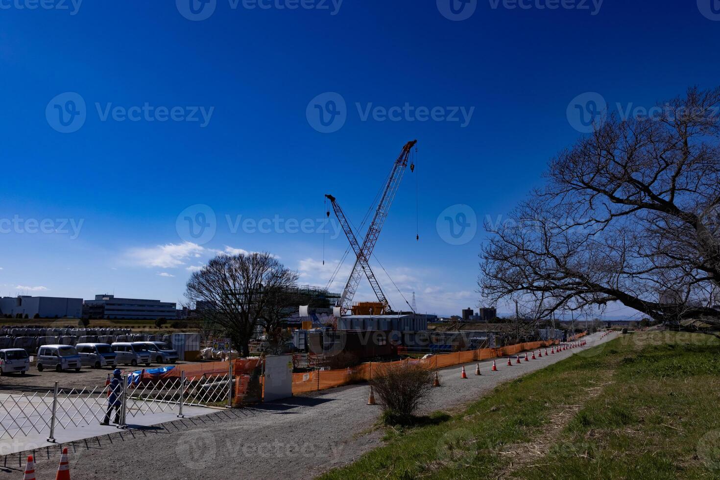 Cranes at the under construction daytime in Tokyo wide shot photo