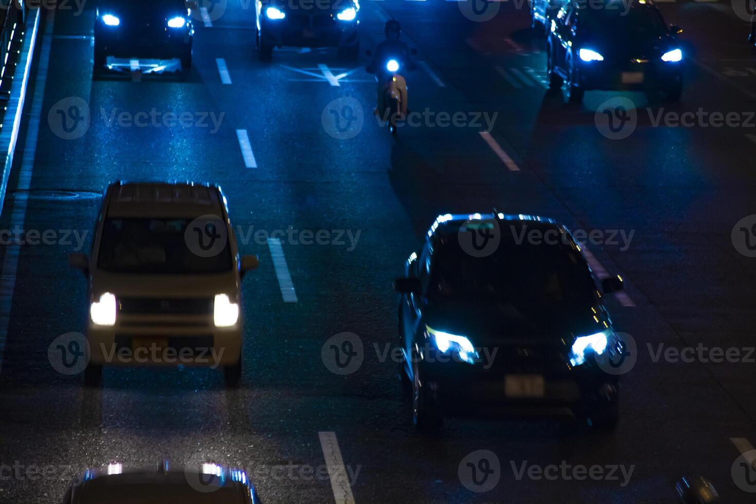 A night traffic jam under the highway in Tokyo long shot photo