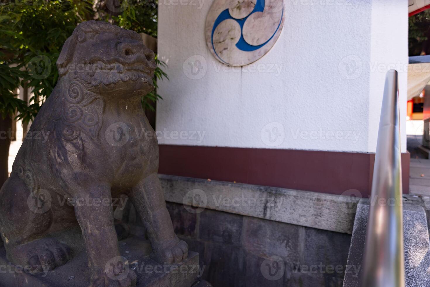 A guardian statue at Tomioka Shrine with copyspace photo