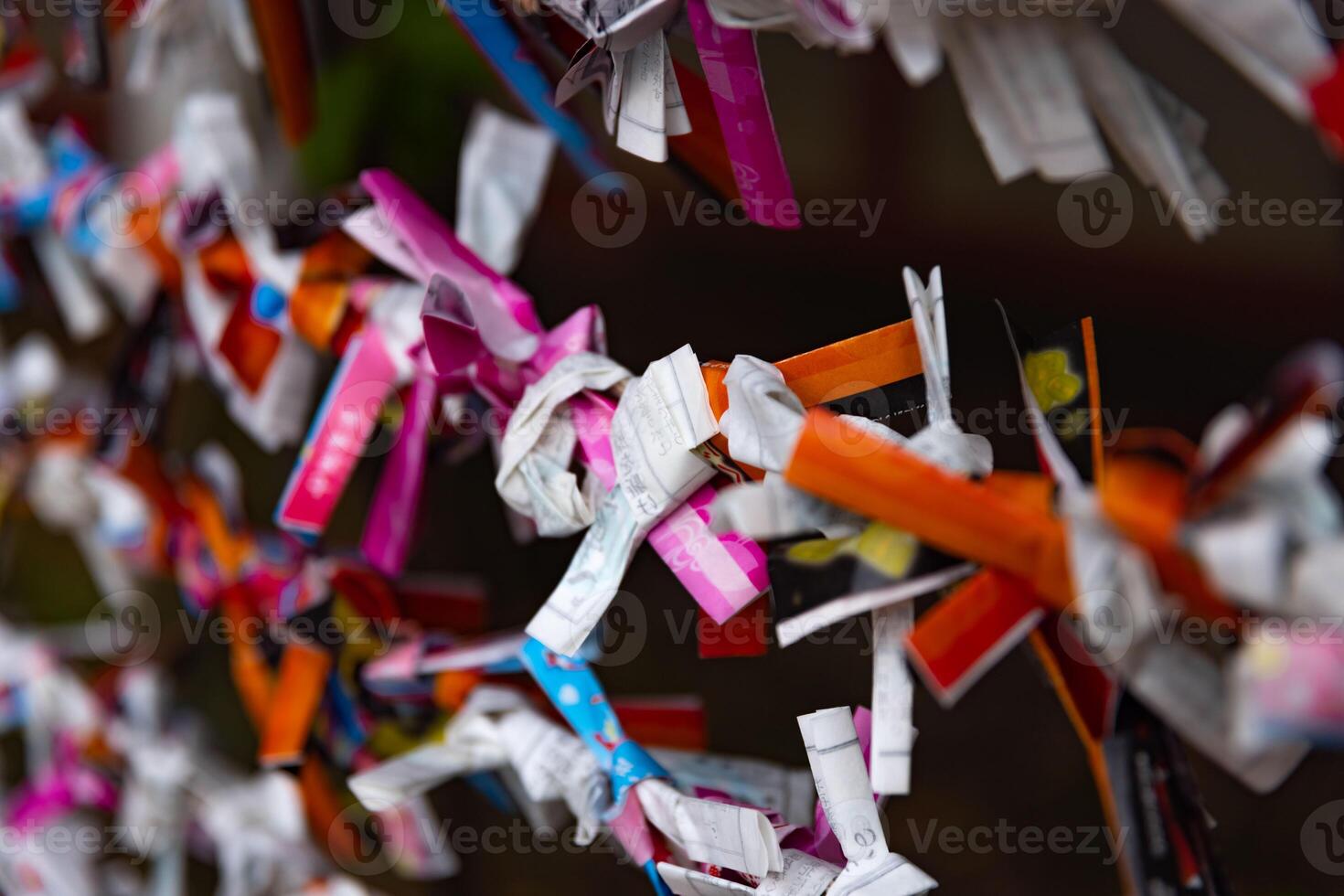 A fortune telling slip at Tomioka Shrine closeup photo