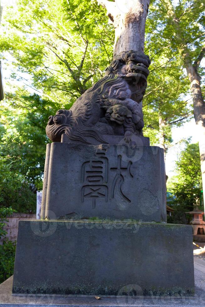 A statue of guardian dog at Japanese Shrine photo