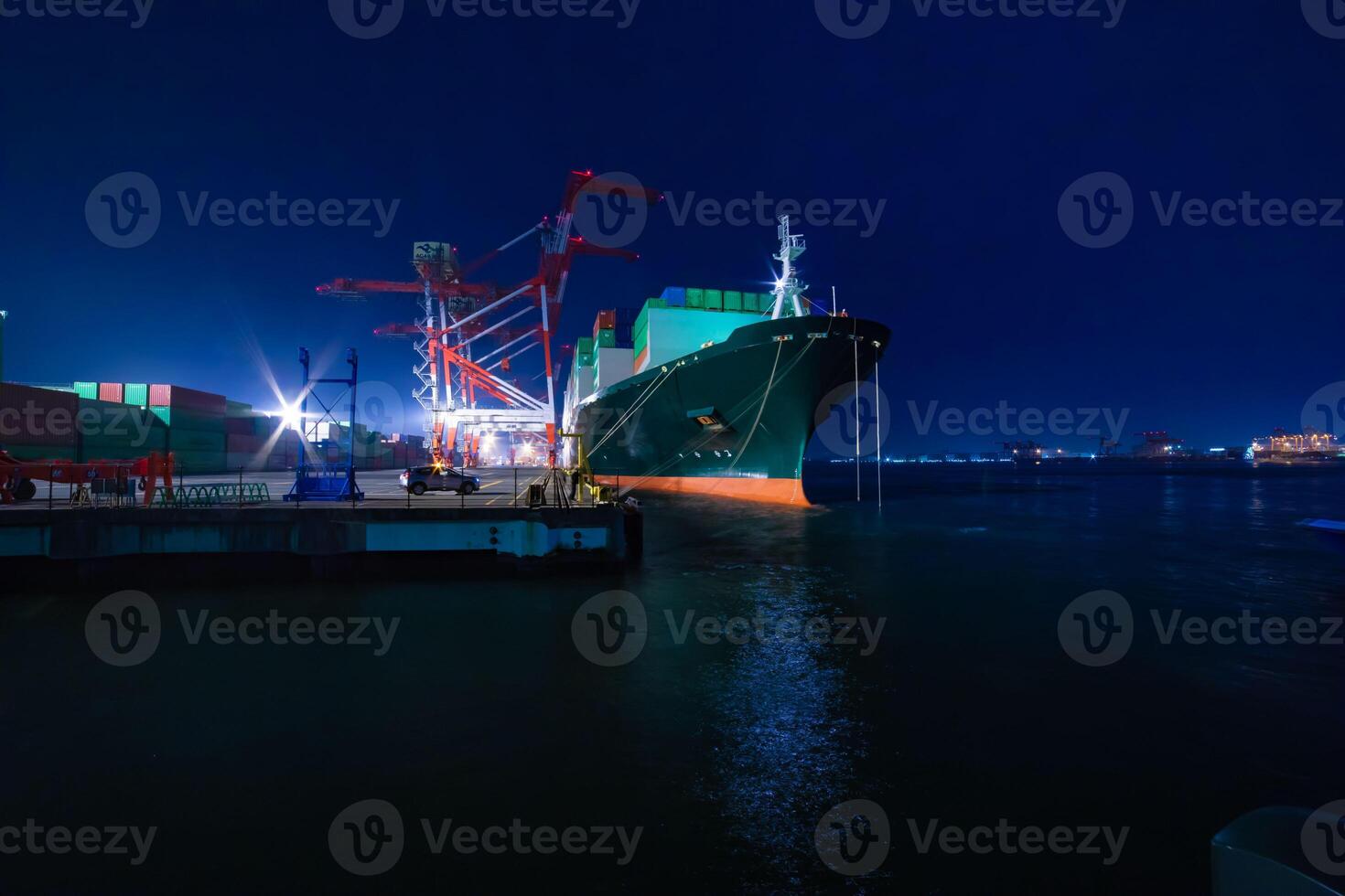 Night cranes near the container port in Tokyo wide shot photo