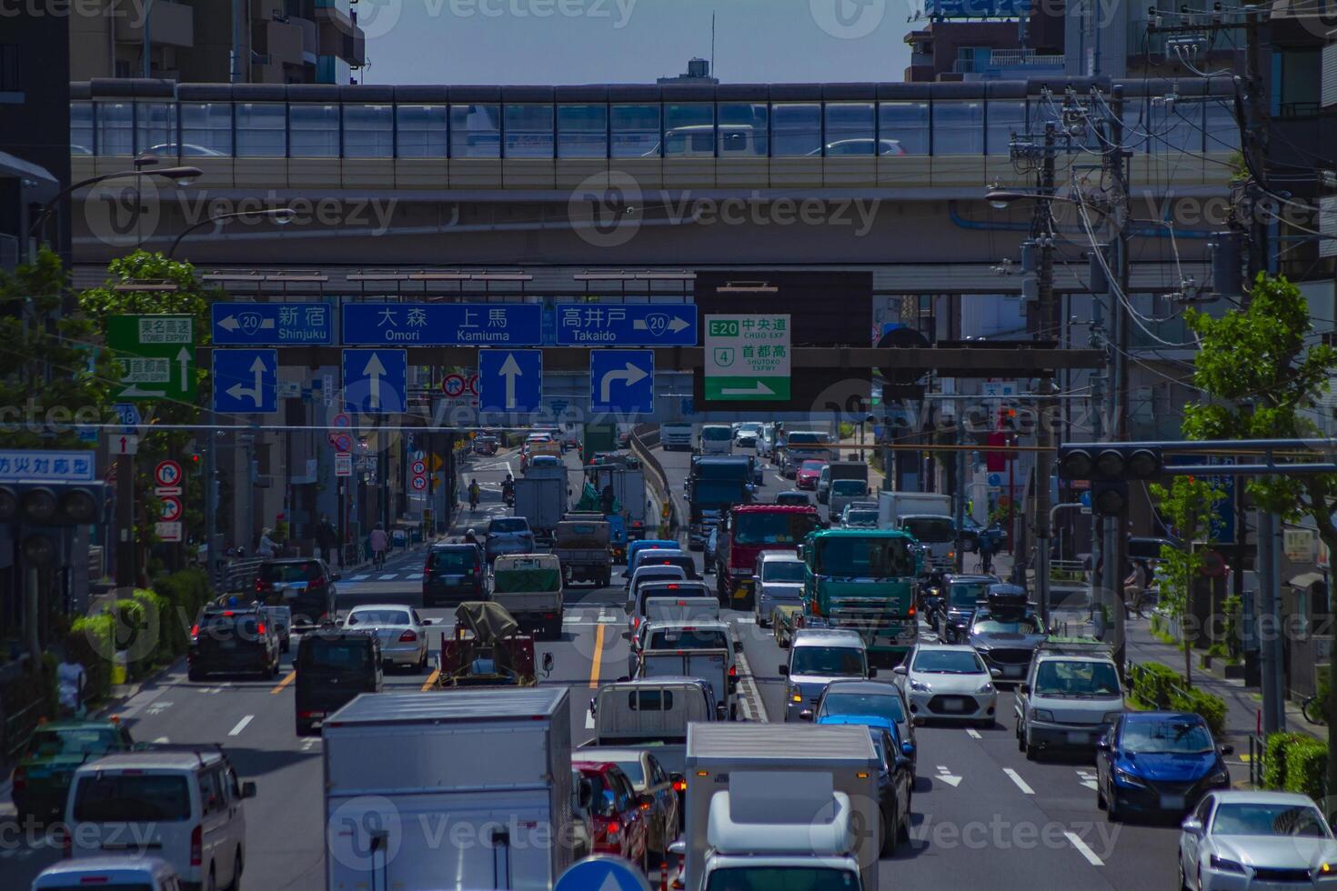 A traffic jam at the urban street in Tokyo long shot photo