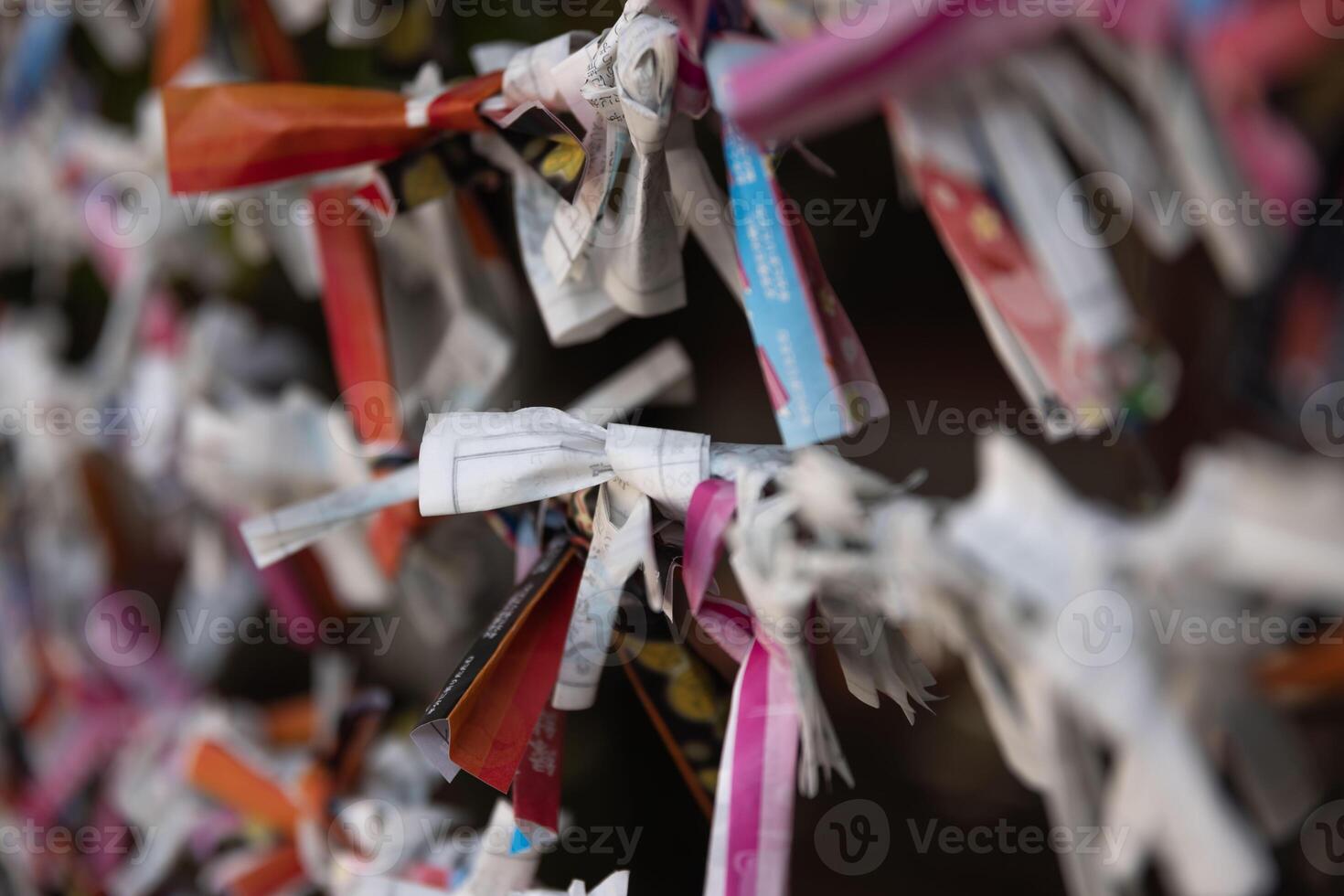 A fortune telling slip at Tomioka Shrine closeup photo