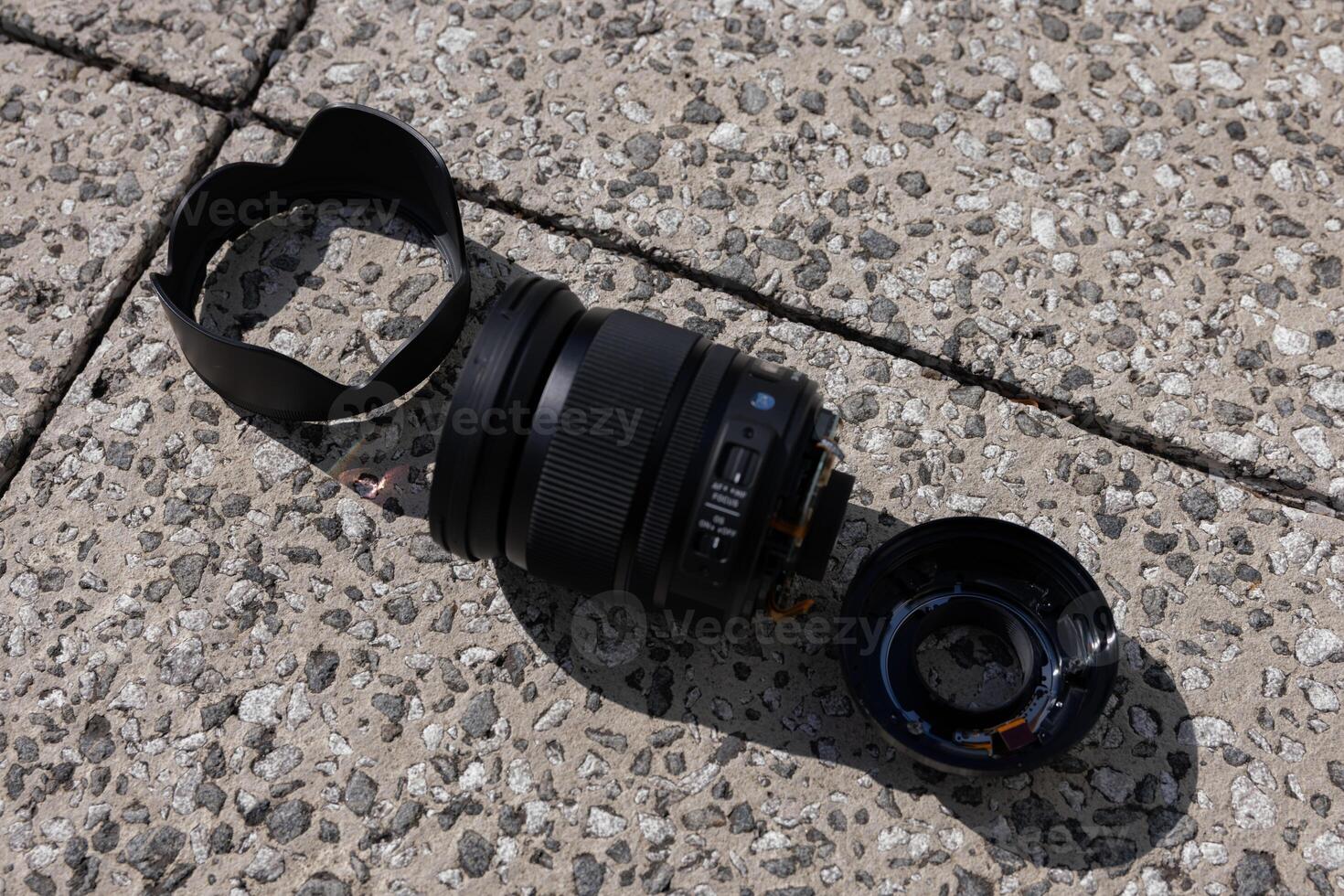 A broken lens on the street sunny day handheld photo