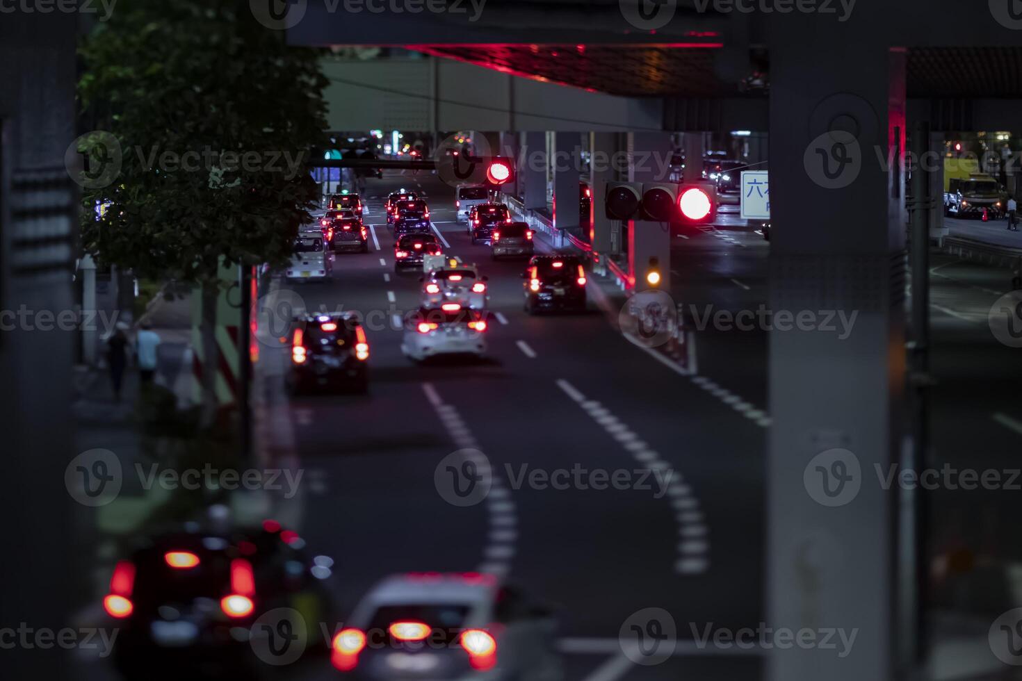 A night miniature traffic jam at the urban street in Tokyo photo