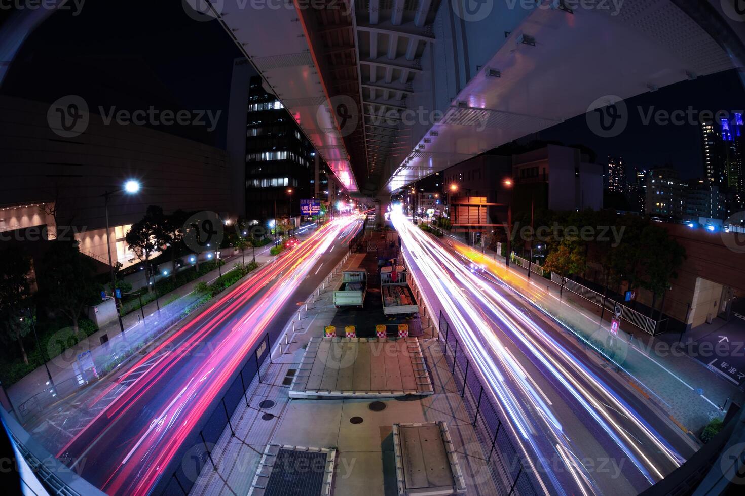 A night timelapse of the traffic jam at the city street in Tokyo fish-eye shot photo